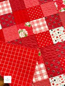 Close up of quilting red patchwork quilt pattern