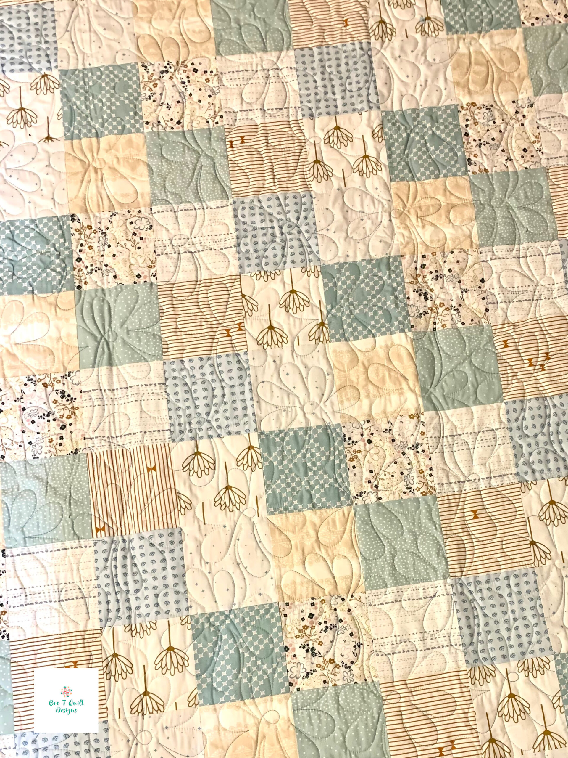 light blue and white patchwork quilt pattern close up
