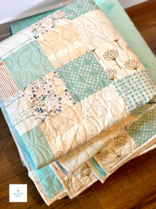 Folded blue and white free patchwork quilt pattern