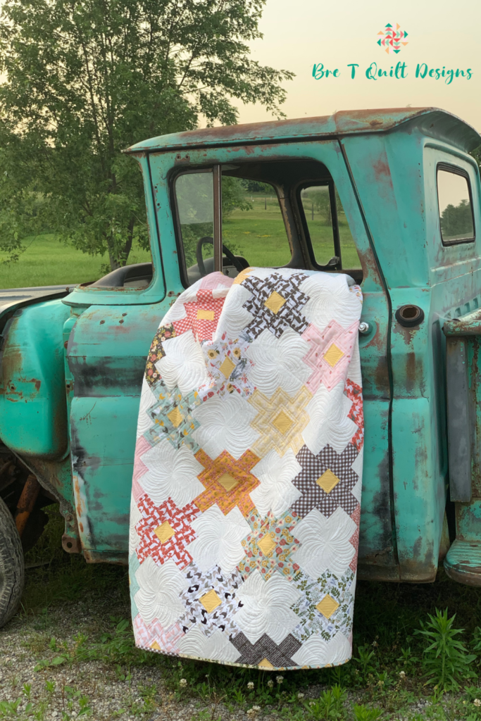 Clover Fields Quilt In Poppy Cotton On Vintage Truck