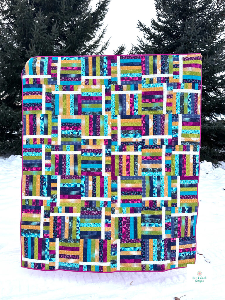 Switchback Rails Quilt Pattern- Bre T Quilt Designs Full quilt photo of a colorful modern quilt pattern, switchback rails, a fence rails quilt pattern.