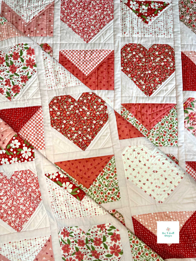Detail view of heart quilt pattern stitching on the Love Letters Valentine quilt