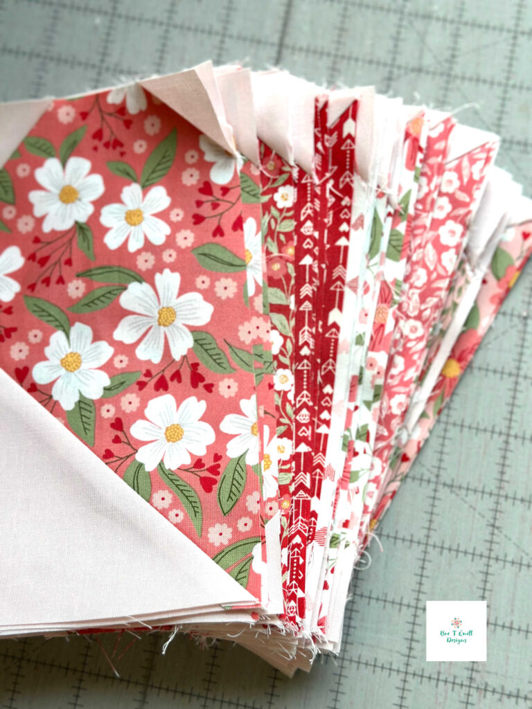 Half-finished heart blocks in progress for the Love Letters Valentine’s Day heart quilt pattern