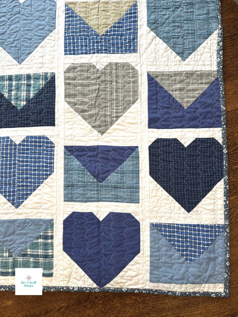 Love Letters Memory Quilt- Bre T Quilt Designs copy 4 A close-up shot of the Love Letters quilt blocks, highlighting the intricate textures of the grandfather's repurposed cotton shirts and the clean white sashing.