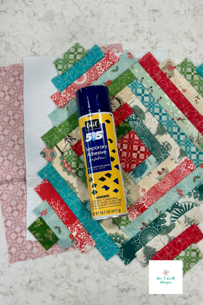 Hot pad quilt top, batting, and backing laid out with 505 spray basting adhesive for a quilt-as-you-go casserole hot pad in Winter Haven fabric