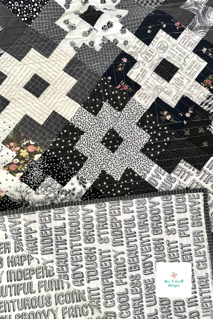 close up of front and back of black and white scrap quilt pattern