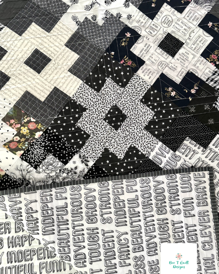 close up of black and white scrap quilt pattern front and back