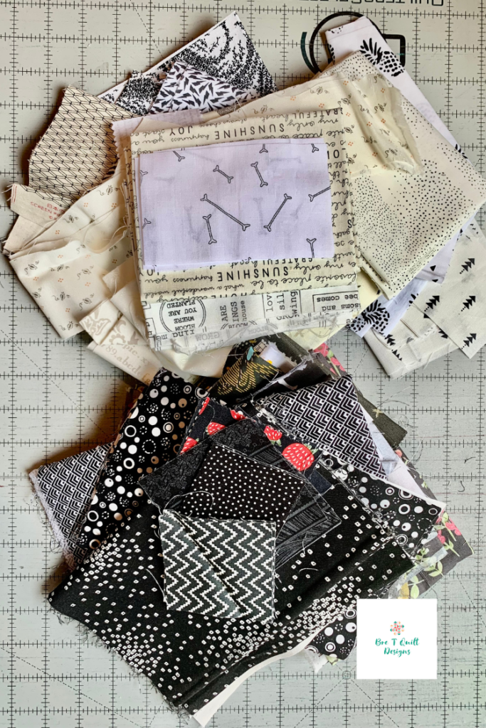 pile of black and white scrap fabrics