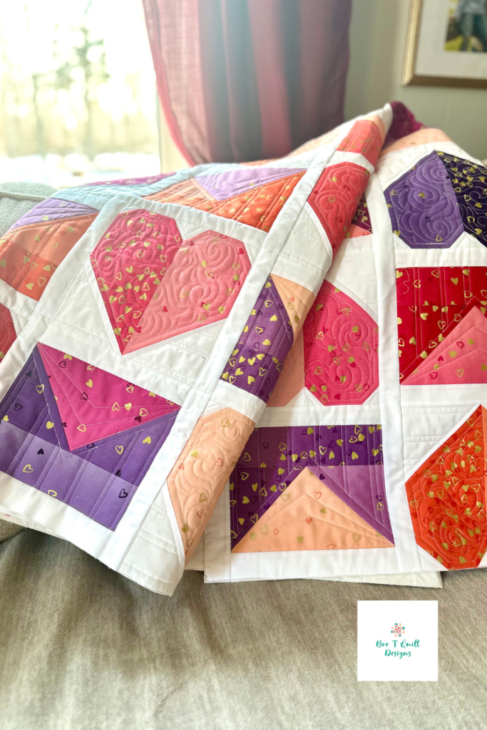 Close-up of swirl quilting by Kelly Borns on the Love Letters ombre heart quilt